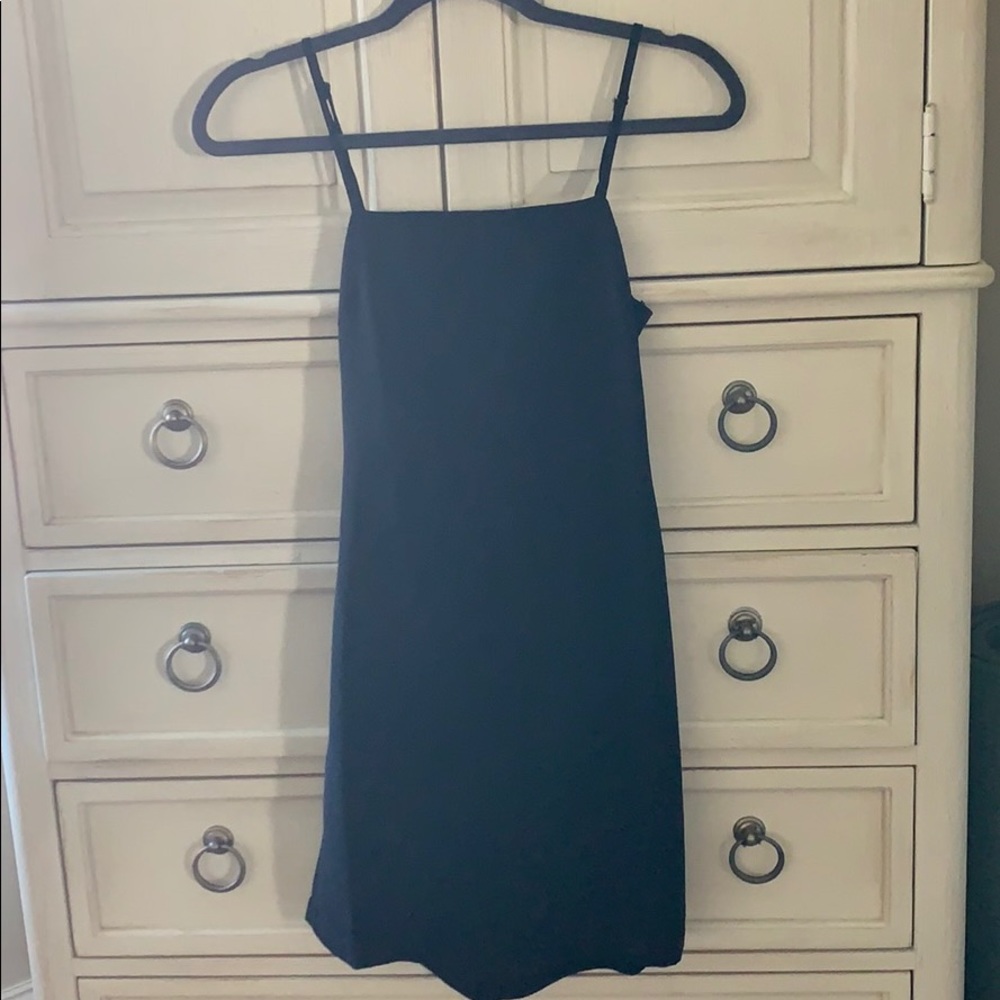 tiny black dress, open back with bow